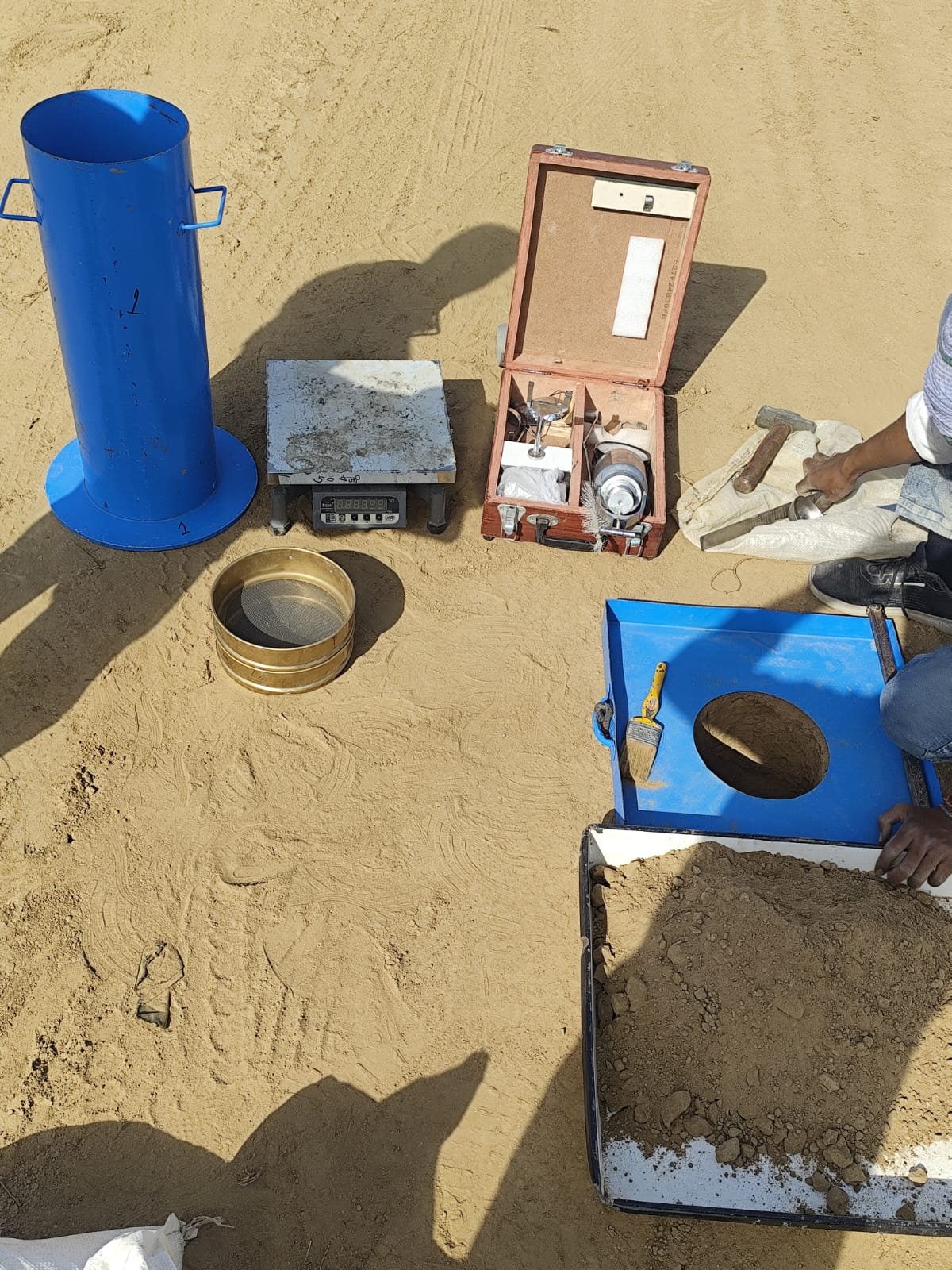 Sand replacement field density test assembly at site