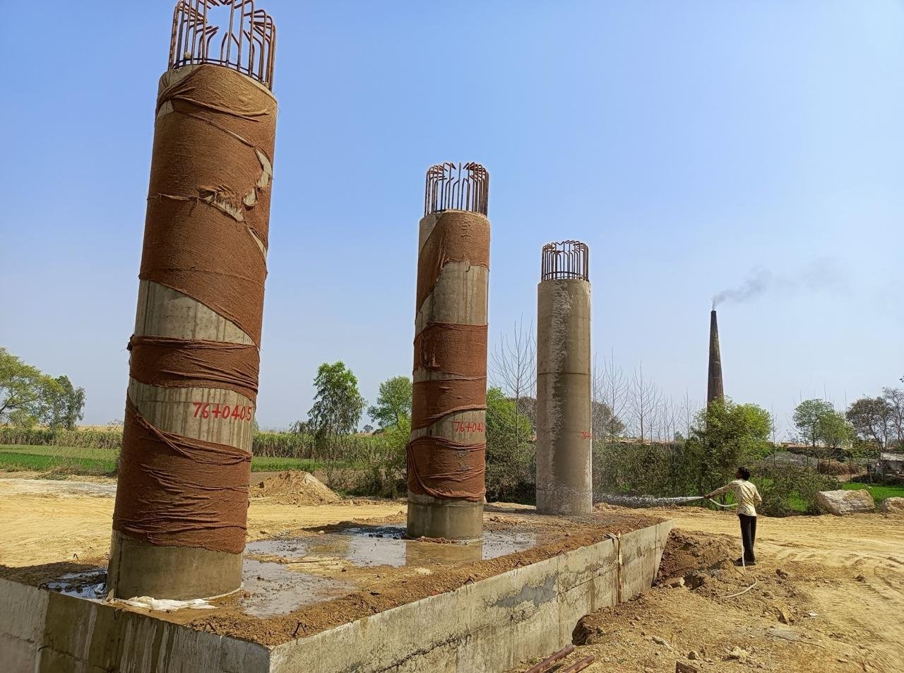 Curing of concrete column at construction site